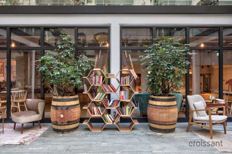 a chair sitting in front of a building