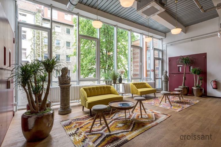 a living room filled with furniture and a fire place