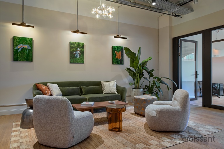 a living room filled with furniture and vase