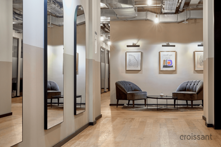 a room filled with furniture and a mirror