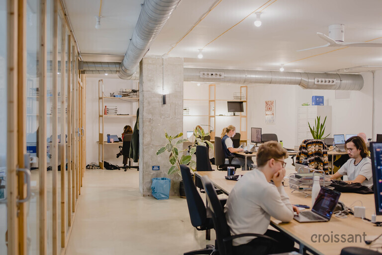 a group of people sitting at a table in a room