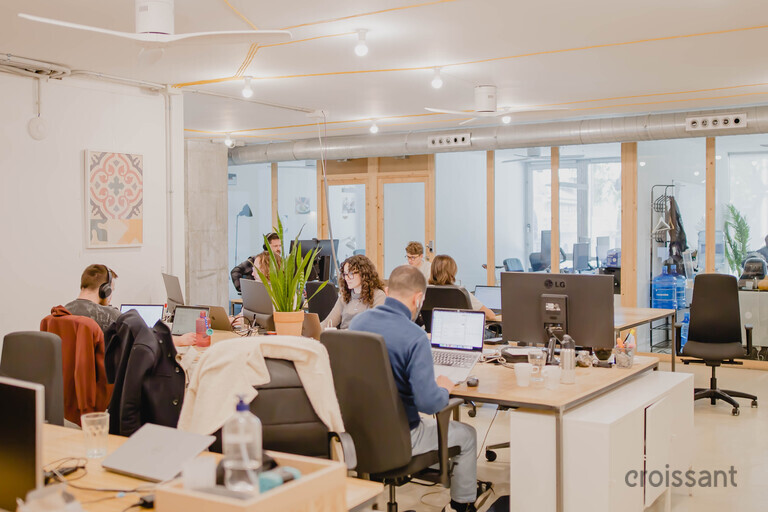 a person sitting at a table in a room