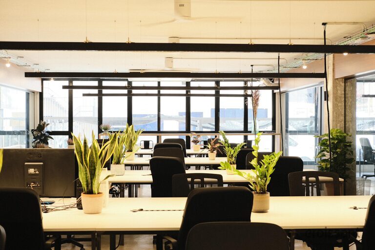 a living room filled with furniture and a large window