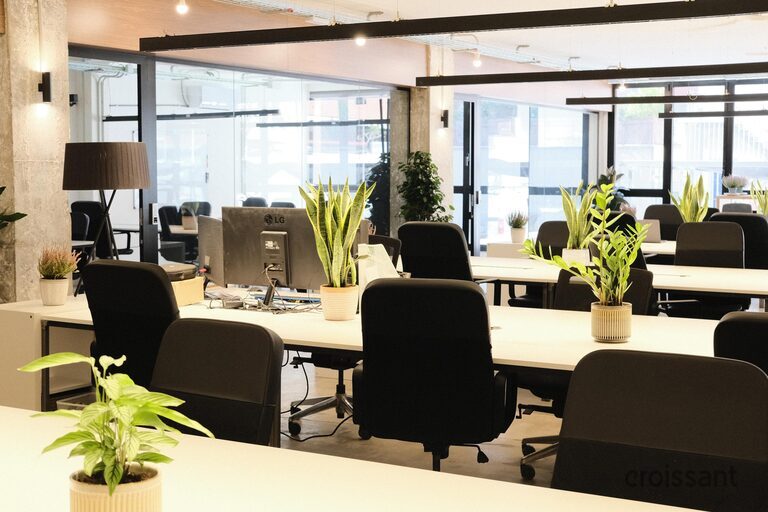 a living room filled with furniture and a large window
