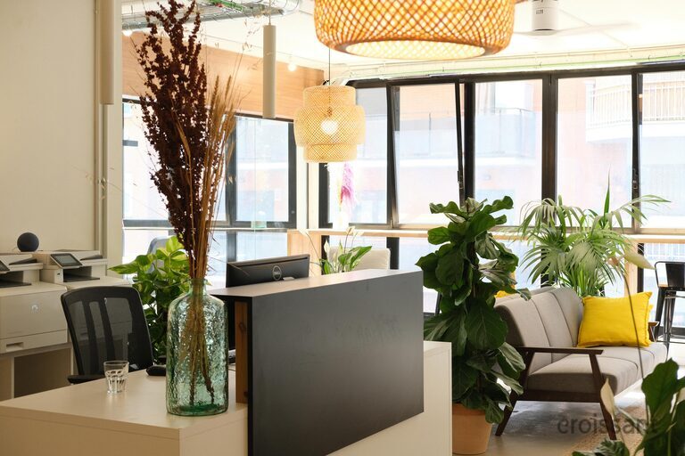 a living room filled with furniture and a large window