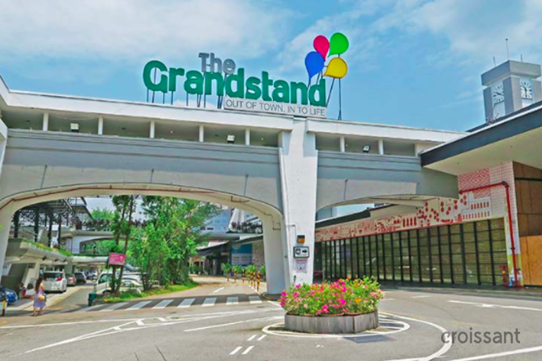 a building that has a sign on the side of a road