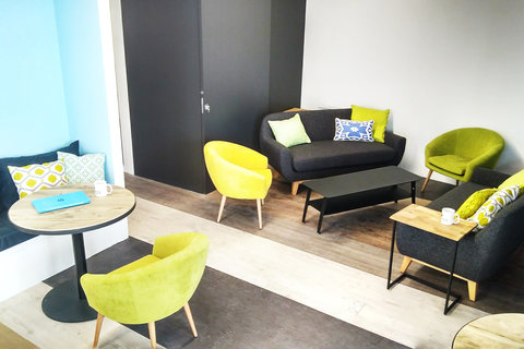 a yellow chair in a room
