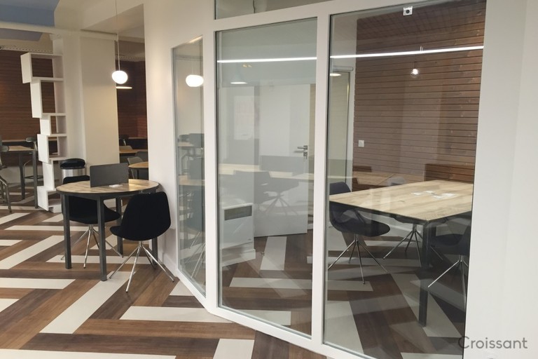 a room filled with furniture and a large window