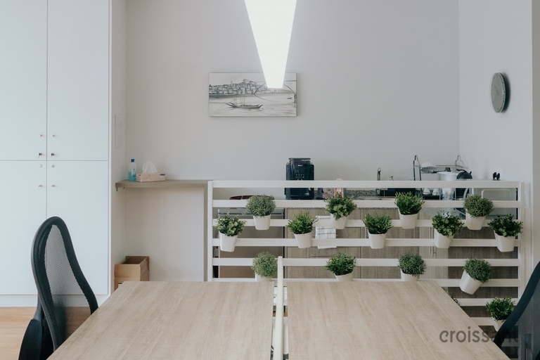 a room filled with furniture and a mirror