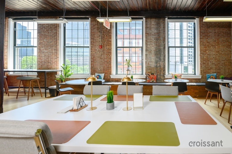 a view of a living room filled with furniture and a fire place