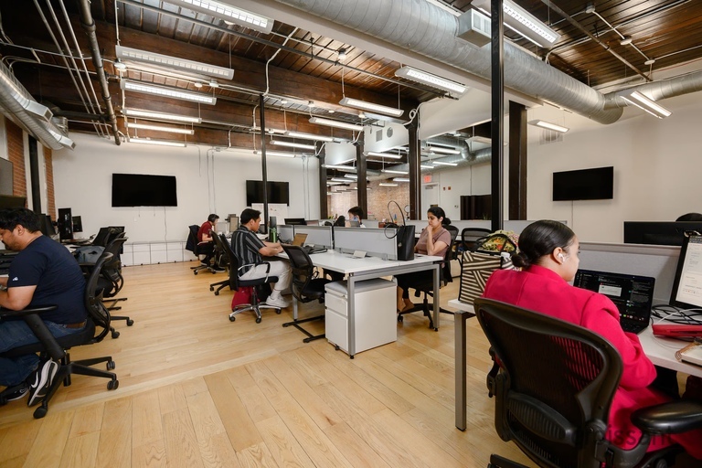a group of people sitting at a table in a room