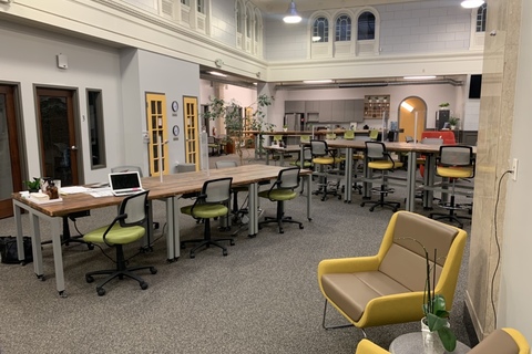 an office with a desk and chair in a room