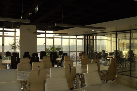 a room filled with furniture and a large window