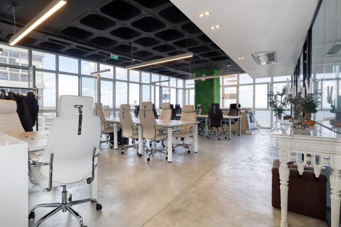 a room filled with furniture and a large window