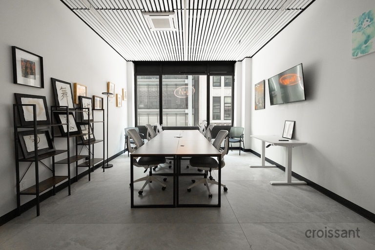 a living room filled with furniture and a large window