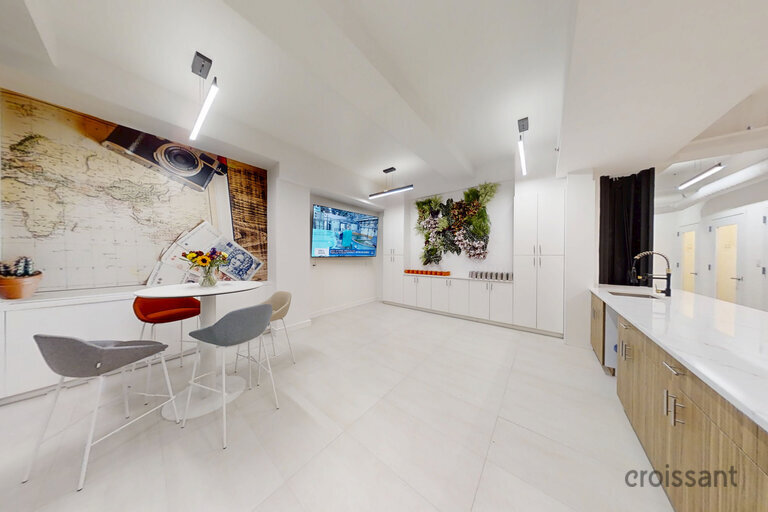 a room filled with furniture and a large window