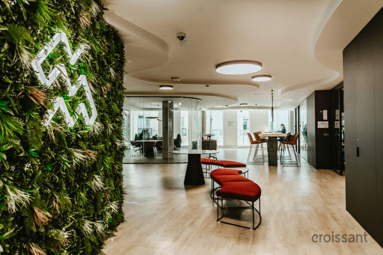 a living room filled with furniture on top of a hard wood floor