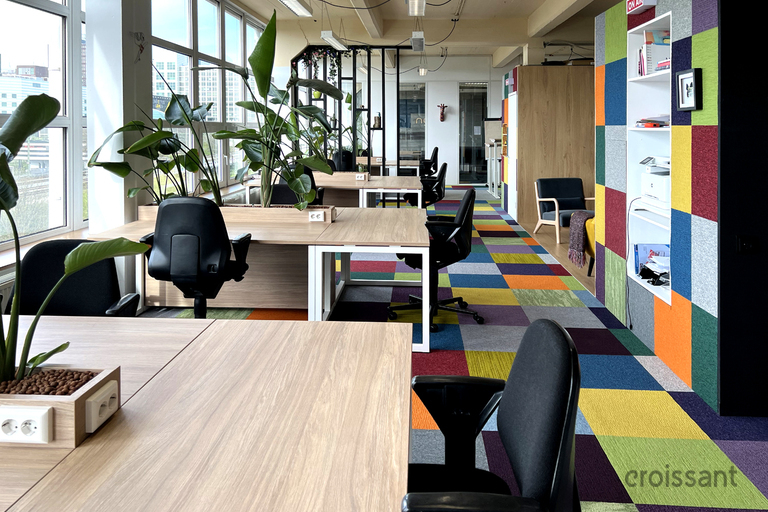 a living room filled with furniture and a large window