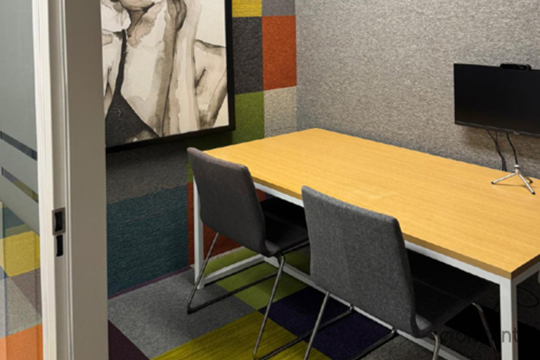 a desk with a chair in a room