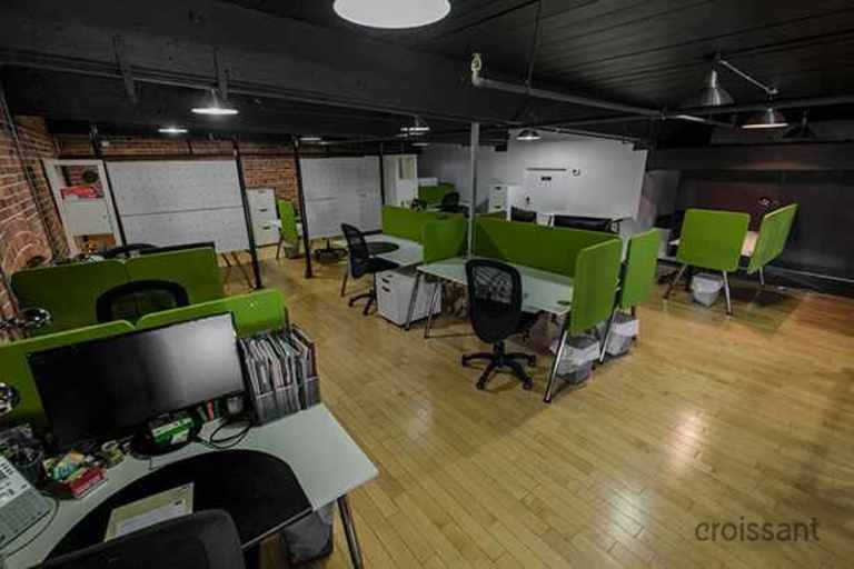 a room filled with furniture on top of a hard wood floor