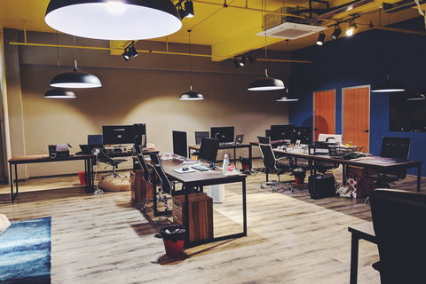 an office with a desk and chair in a room