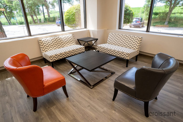 a dining room table in front of a window