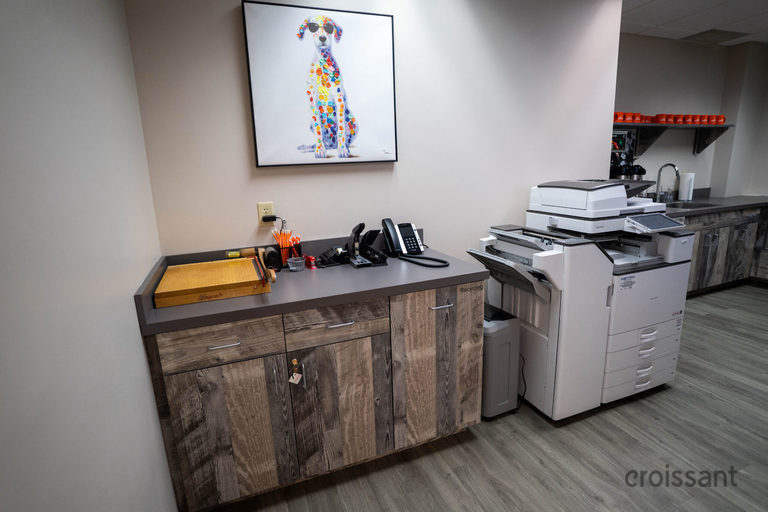 a kitchen with a sink and a mirror