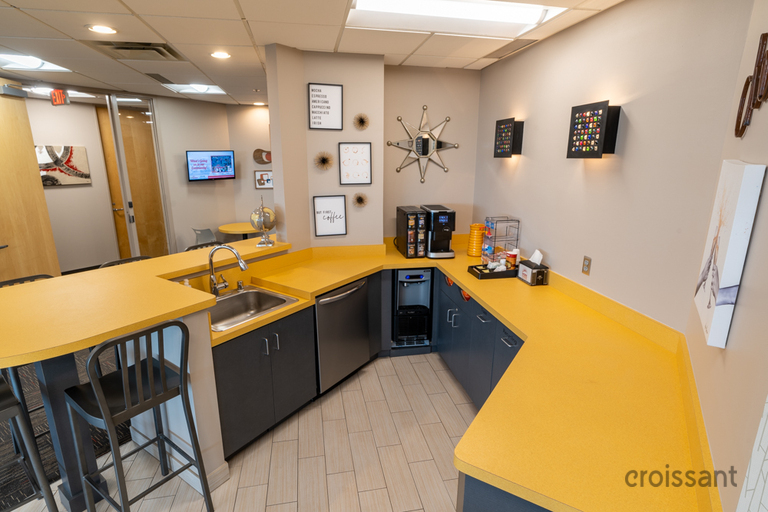 a kitchen with a table in a room