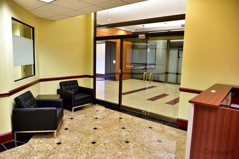 a room filled with furniture and a large window