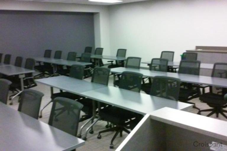 a desk with a laptop in a room