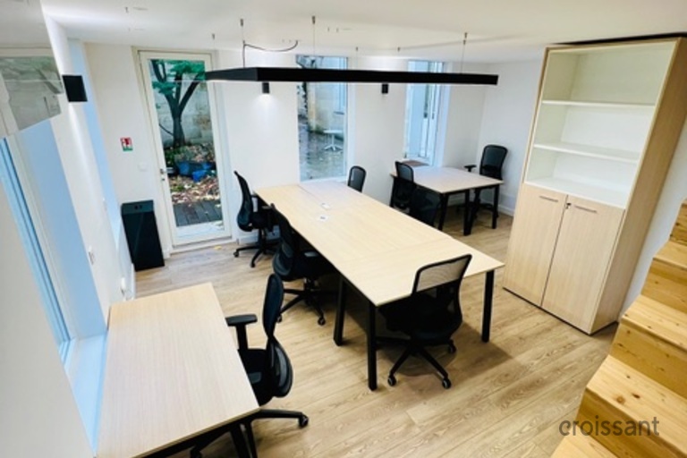 a room filled with furniture and a wood floor