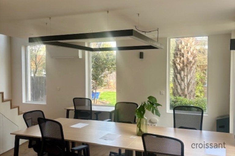 a living room filled with furniture and a large window