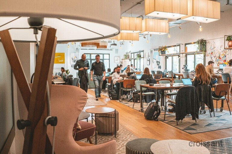 a group of people sitting at a table in a room