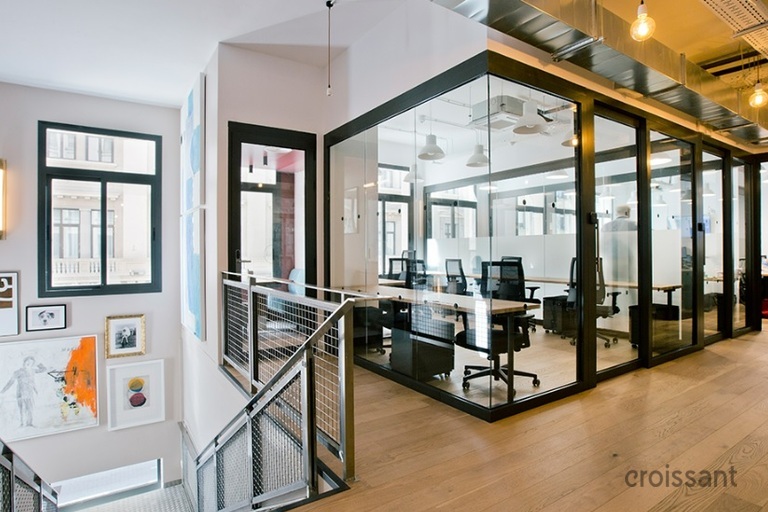 a room filled with furniture and a large window