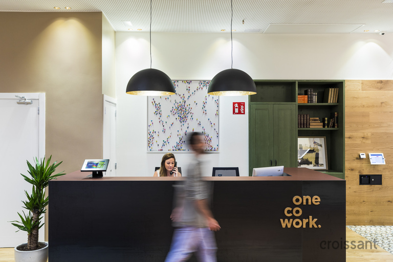 a man walking past a counter