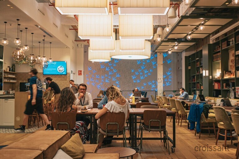 a group of people sitting at a table in a room