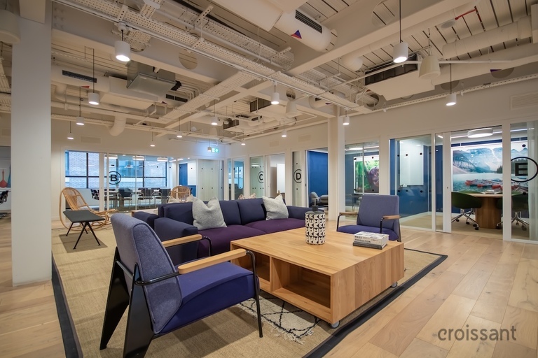 a room filled with furniture and a large window