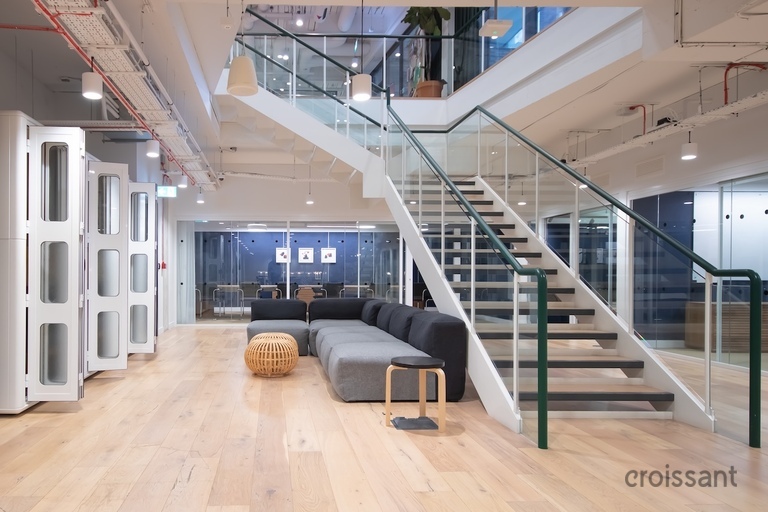 a room filled with furniture in front of a building
