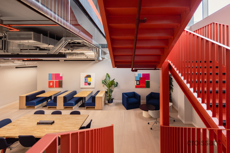 a laptop computer sitting on top of a wooden chair