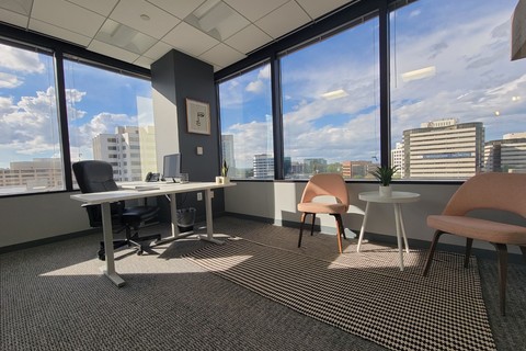 a room filled with furniture and a large window