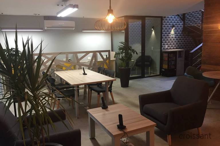 a living room filled with furniture and a large window