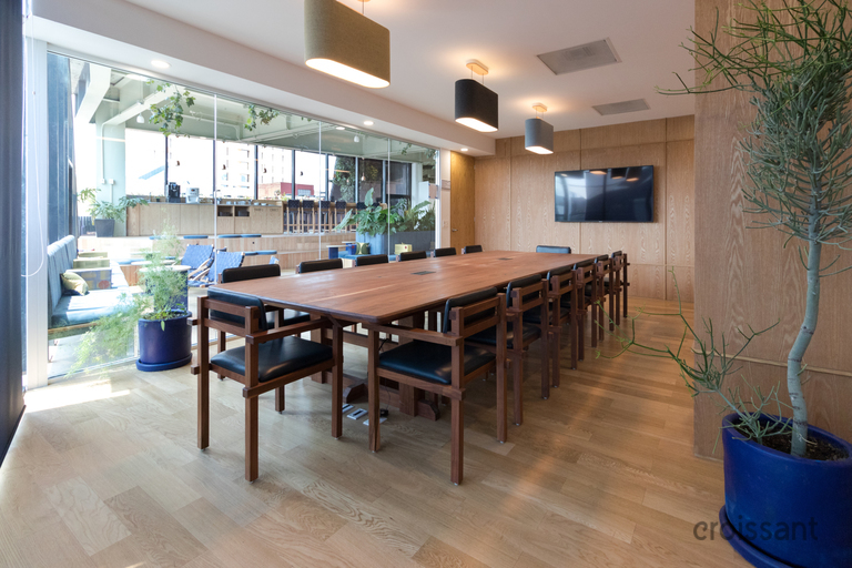 a dining room table in front of a window