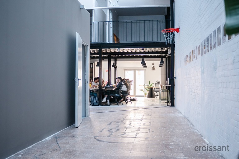 a building that has a sign on a sidewalk