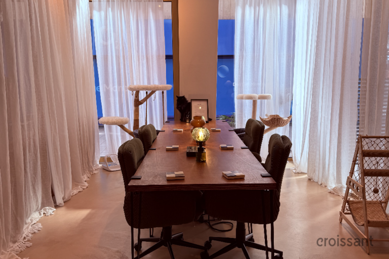 a living room filled with furniture and a large window