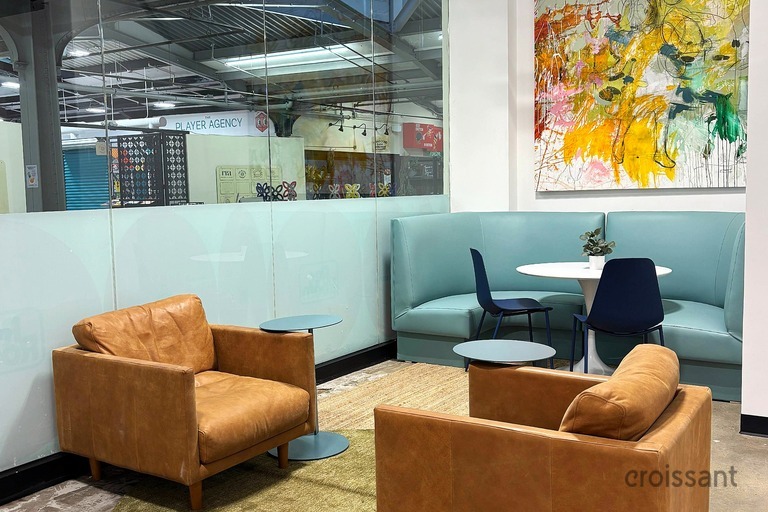 a room filled with furniture and a box on a table