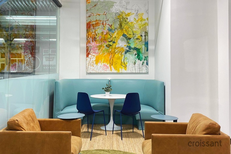 a chair sitting in front of a building