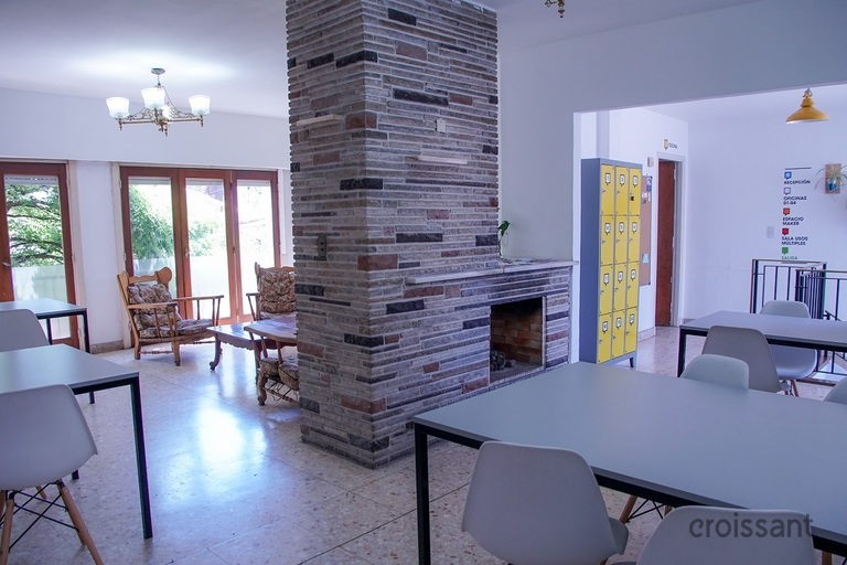 a living room filled with furniture and a large window