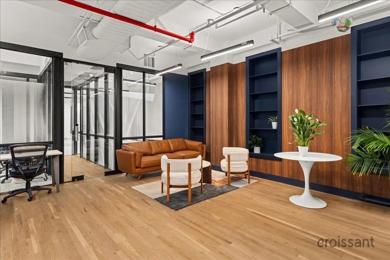 a room filled with furniture and a large window