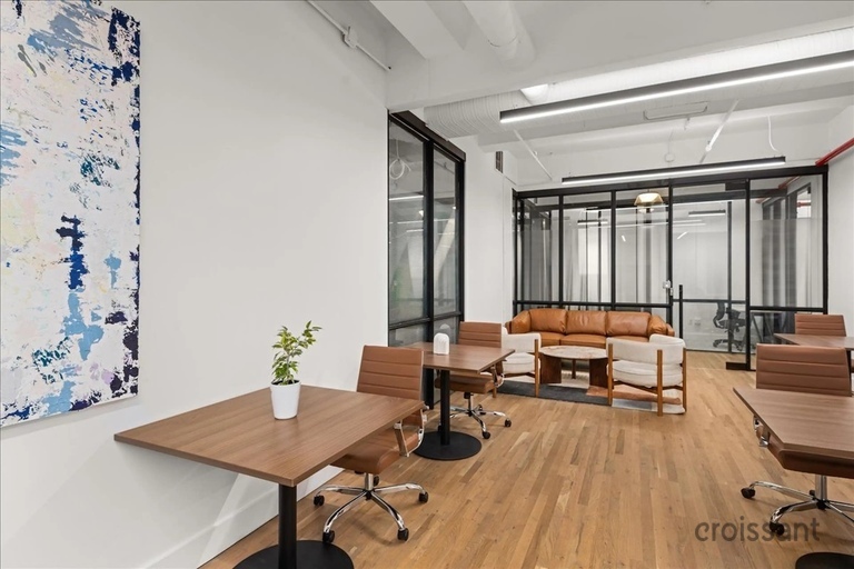 a living room filled with furniture and a large window