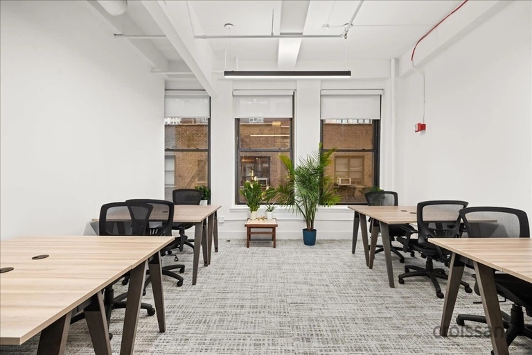 a room filled with furniture on top of a wooden table
